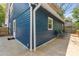 Spacious back deck showcases the blue siding and complements outdoor seating, perfect for entertaining guests at 166 Franklin Nw Ave, Concord, NC 28025