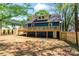 Expansive backyard featuring a large wood deck, new fencing, and ample yard space at 166 Franklin Nw Ave, Concord, NC 28025