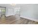Spacious bedroom with hardwood floors, light blue walls, and multiple windows at 166 Franklin Nw Ave, Concord, NC 28025