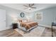 Charming bedroom with a ceiling fan, decorative mirror and wood-look flooring at 166 Franklin Nw Ave, Concord, NC 28025