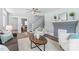 Bright living room with neutral decor, a fireplace, and hardwood floors offers a stylish and welcoming atmosphere at 166 Franklin Nw Ave, Concord, NC 28025