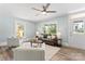 Inviting living area featuring wood floors, neutral decor, and natural light showcases this home's appeal at 166 Franklin Nw Ave, Concord, NC 28025