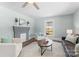Cozy living room featuring a faux fireplace, hardwood floors, and neutral walls and trim, creating an inviting space at 166 Franklin Nw Ave, Concord, NC 28025