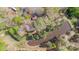 Aerial view of the property featuring wooded acreage and a pond at 170 Dusty Loop Dr, Mount Gilead, NC 27306