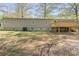 Backyard view of the home featuring a cozy deck area, ideal for relaxing at 170 Dusty Loop Dr, Mount Gilead, NC 27306