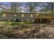 Home features a backyard with a deck and ample natural light, perfect for outdoor entertaining at 170 Dusty Loop Dr, Mount Gilead, NC 27306
