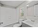 Clean bathroom featuring white tile, vanity, and a window with a view at 170 Dusty Loop Dr, Mount Gilead, NC 27306