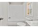 Bright bathroom with white tiled tub and shower, and a window at 170 Dusty Loop Dr, Mount Gilead, NC 27306