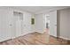 Cozy bedroom with wood-look floors, closet, and an open doorway at 170 Dusty Loop Dr, Mount Gilead, NC 27306