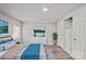 Comfortable bedroom featuring wood-look floors, ceiling fan, and neutral walls at 170 Dusty Loop Dr, Mount Gilead, NC 27306