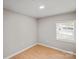 Simple bedroom with wood floors and a single window at 170 Dusty Loop Dr, Mount Gilead, NC 27306