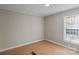 Small bedroom with hardwood floors and a single window at 170 Dusty Loop Dr, Mount Gilead, NC 27306
