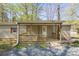 Inviting front porch with wooden railings and ramp access to the entrance at 170 Dusty Loop Dr, Mount Gilead, NC 27306