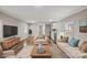 Staged living room features stylish furniture, wood flooring, and neutral decor at 170 Dusty Loop Dr, Mount Gilead, NC 27306