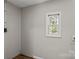 Small room with hardwood floors and a single window at 170 Dusty Loop Dr, Mount Gilead, NC 27306