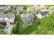 An aerial view of a home with a large backyard, patio, and surrounded by lush greenery at 1809 Robbins Meadows Dr, Waxhaw, NC 28173
