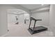 Basement gym with workout equipment, neutral walls, carpet and recessed lighting for a bright fitness space at 1809 Robbins Meadows Dr, Waxhaw, NC 28173