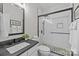 Modern bathroom featuring sleek finishes, walk-in shower, and stylish vanity with dark countertop at 1809 Robbins Meadows Dr, Waxhaw, NC 28173
