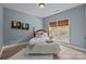 Cozy bedroom offering natural light, wood floors, and a calming atmosphere at 1809 Robbins Meadows Dr, Waxhaw, NC 28173