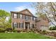Beautiful brick home with manicured lawn and mature landscaping; a welcoming front entrance at 1809 Robbins Meadows Dr, Waxhaw, NC 28173