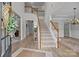 Bright foyer with hardwood floors, soaring ceilings and staircase; a welcoming entrance at 1809 Robbins Meadows Dr, Waxhaw, NC 28173