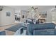 Open living room with plenty of seating, neutral paint, wood flooring and an adjacent kitchen at 1809 Robbins Meadows Dr, Waxhaw, NC 28173