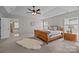 Bright and airy main bedroom features a stylish ensuite bathroom, windows, and tray ceiling at 1809 Robbins Meadows Dr, Waxhaw, NC 28173