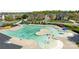 Community pool featuring a slide, splash pad, and zero entry, surrounded by well-manicured lawns and neighborhood homes at 1809 Robbins Meadows Dr, Waxhaw, NC 28173