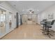 Large recreation room featuring tile floors, built-in shelves, wet bar, and exterior access at 1809 Robbins Meadows Dr, Waxhaw, NC 28173