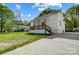 Quaint single-story home featuring a welcoming front porch and an expansive driveway at 1901 Parkdale Ave, Gastonia, NC 28052