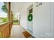 Charming front porch adorned with a wreath and 