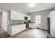 Well-lit kitchen with white cabinetry, stainless appliances, and granite countertops at 1901 Parkdale Ave, Gastonia, NC 28052