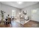 Bright living and dining area with hardwood floors and stylish, modern furniture at 1901 Parkdale Ave, Gastonia, NC 28052