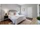 Bedroom showcases hardwood floors, a large bed and a plush rug at 1901 Parkdale Ave, Gastonia, NC 28052