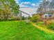 Home featuring a backyard with mature trees and a swing set at 1910 York Hwy, York, SC 29745
