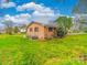 A brick home with a large, well-maintained grassy backyard at 1910 York Hwy, York, SC 29745