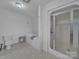 Bathroom features a toilet, jacuzzi tub with blue towel and a stand-up shower with sliding glass door at 1910 York Hwy, York, SC 29745