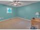 Comfortable bedroom features neutral carpet, ceiling fan, and a window with natural light at 1910 York Hwy, York, SC 29745
