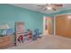 Spacious bedroom with neutral carpet, ceiling fan, and closet space for storage at 1910 York Hwy, York, SC 29745
