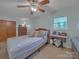 Charming bedroom with a comfortable bed, natural light, and built-in storage at 1910 York Hwy, York, SC 29745