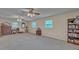 Large bonus room featuring neutral carpet and two ceiling fans at 1910 York Hwy, York, SC 29745