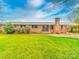 Charming brick ranch home featuring a spacious front yard and a convenient covered carport at 1910 York Hwy, York, SC 29745