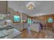Bright eat-in kitchen features granite countertops, stainless appliances, and wood floors at 1910 York Hwy, York, SC 29745