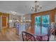 Eat-in kitchen featuring white cabinets, wood flooring, an island, and stainless steel appliances at 1910 York Hwy, York, SC 29745