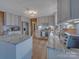 Kitchen with stainless steel appliances, white cabinets, and an island at 1910 York Hwy, York, SC 29745