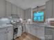 Modern kitchen with stainless steel appliances, granite counters and beautiful lighting at 1910 York Hwy, York, SC 29745