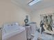 Functional laundry room with ample space for appliances, storage and drying rack at 1910 York Hwy, York, SC 29745