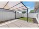 A cozy backyard seating area with concrete patio and privacy fence for relaxing outdoors at 219 Edinburgh Ct, Mount Holly, NC 28120