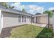 Spacious backyard with an awning and a well-maintained lawn and mulch beds at 219 Edinburgh Ct, Mount Holly, NC 28120