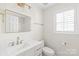 Modern bathroom featuring a vanity, mirror, and window with shutters at 219 Edinburgh Ct, Mount Holly, NC 28120
